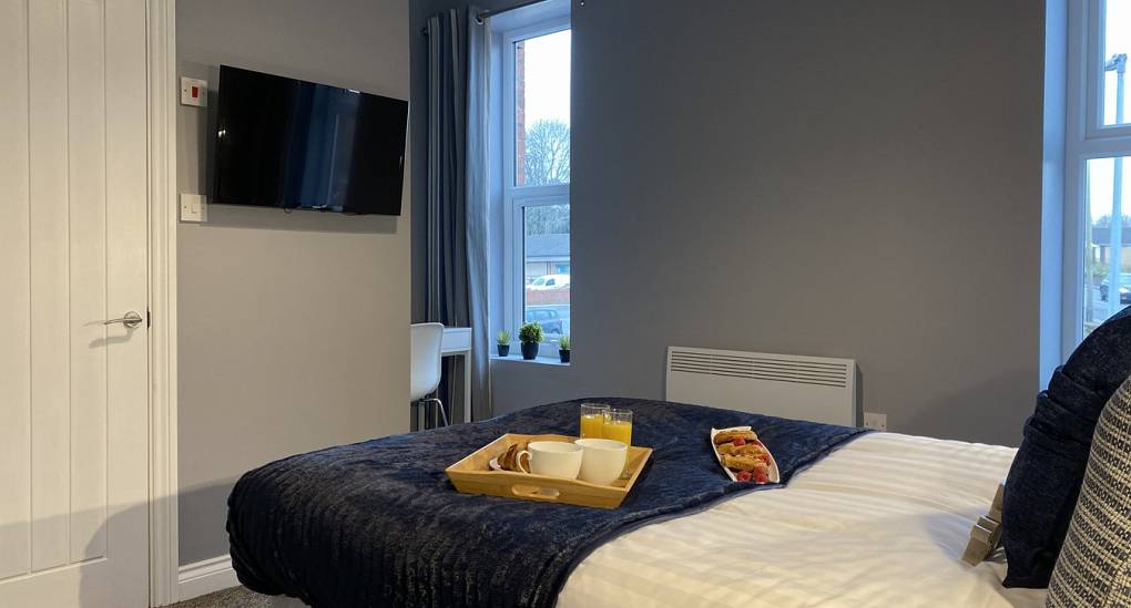 Bedroom with double bed and tv