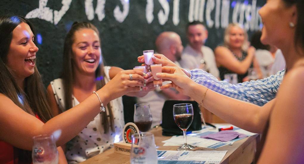 A hen do at the Bierkeller enjoying a shot